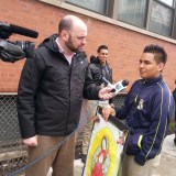 Edgar Muniz speaking with a reporterb